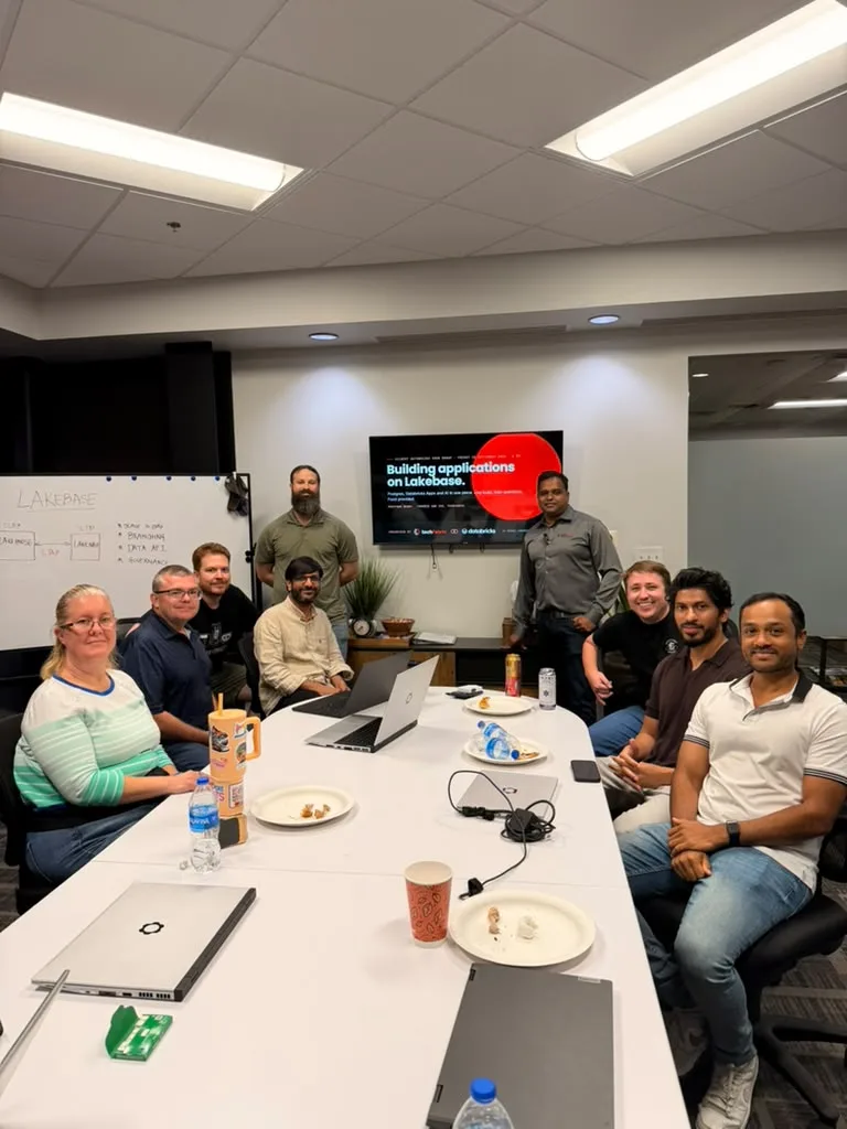 The group at the end of the evening, around the table in front of the title slide.